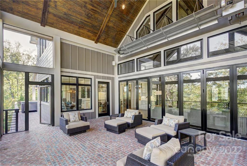 2188 Bessbrook Road Fort Mill, SC 29708 - Photo 1 of 48 a living room with furniture tv and floor to ceiling windows