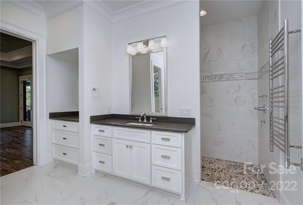 2188 Bessbrook Road Fort Mill, SC 29708 - Photo 23 of 48 a bathroom with a granite countertop sink a vanity and a mirror