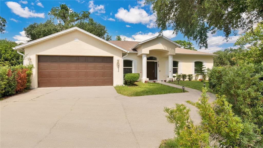 a front view of a house with yard