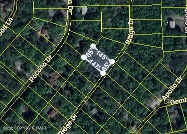 a view of outdoor space with a garden and signage