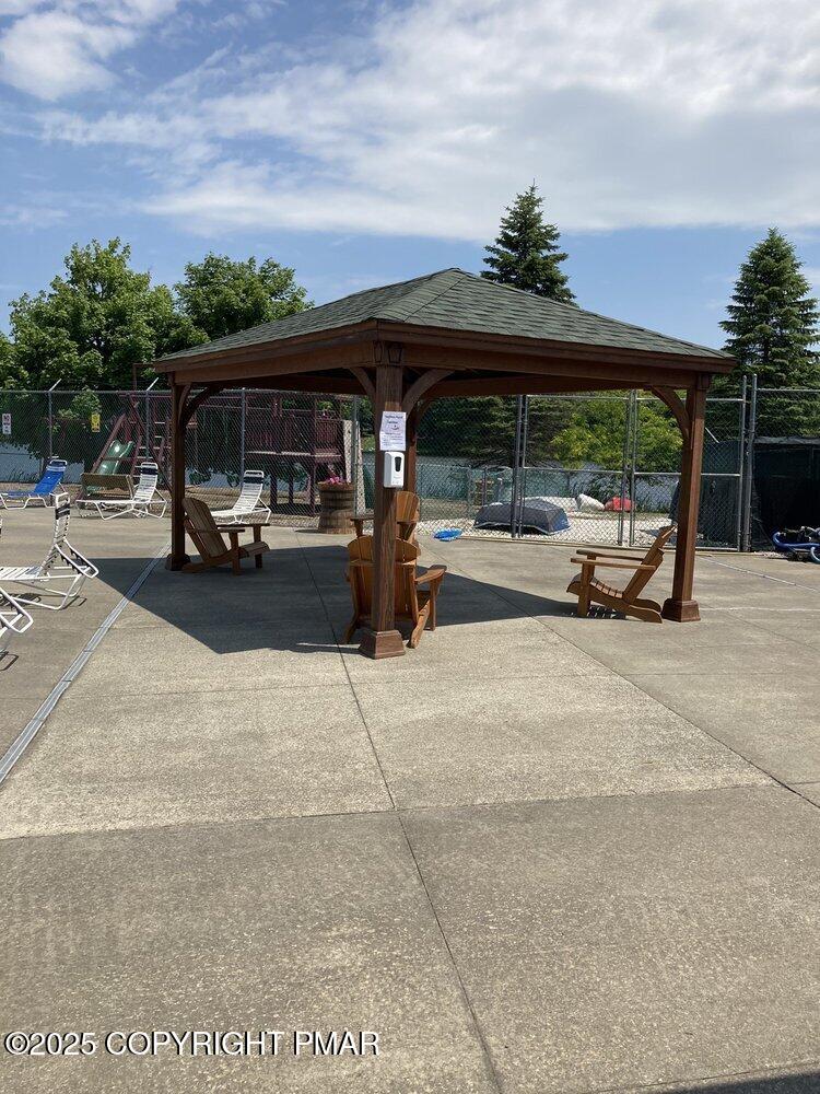 Lot 103 Ridge Drive Gouldsboro, PA 18424 - Photo 6 of 7 a view of patio with table and chairs under an umbrella