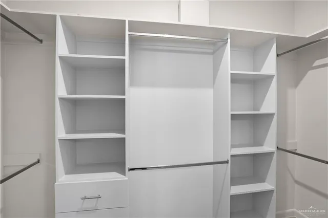 a view of an empty walk in closet