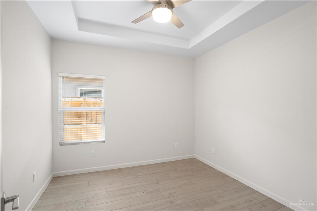 3416 Duke Avenue, Unit 3 McAllen, TX 78504 - Photo 7 of 15 an empty room with a window