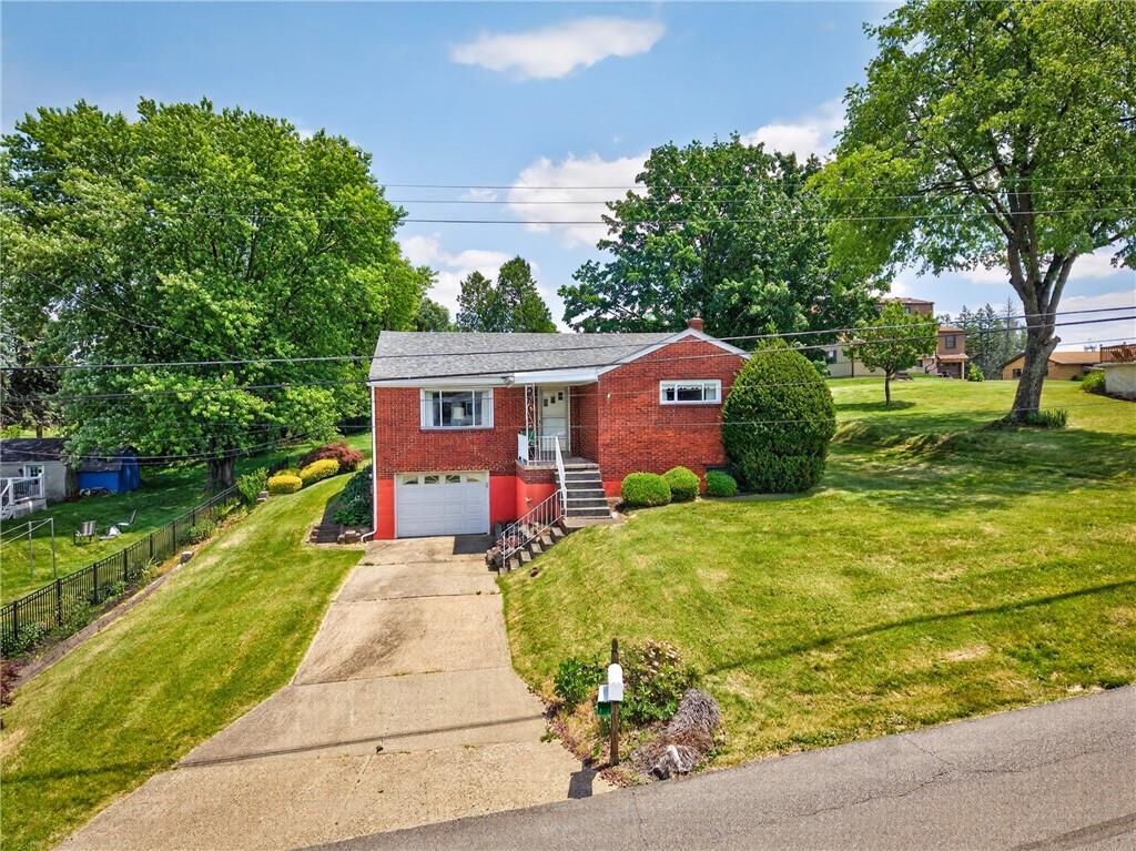 186 William Street McKees Rocks, PA 15136 - Photo 3 of 45 a front view of house with yard and green space