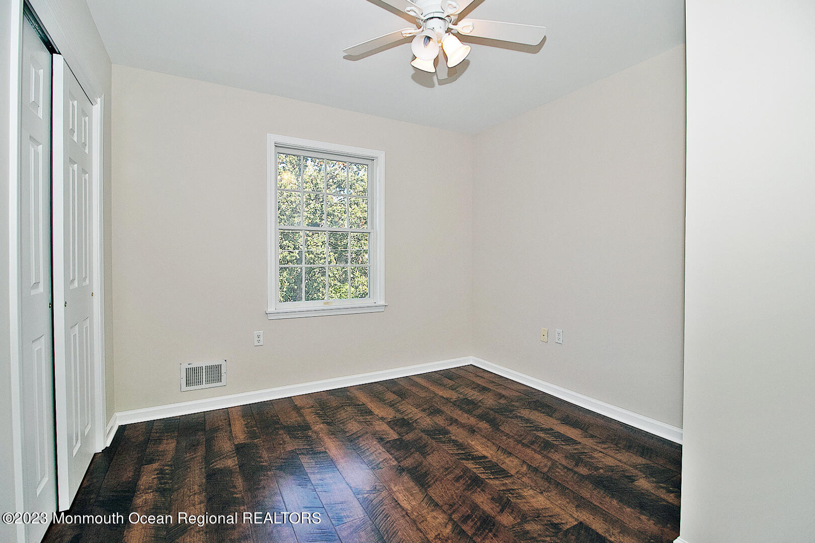 2117 Whitcomb Road Forked River, NJ 08731 - Photo 29 of 49 wooden floor in an empty room with a window