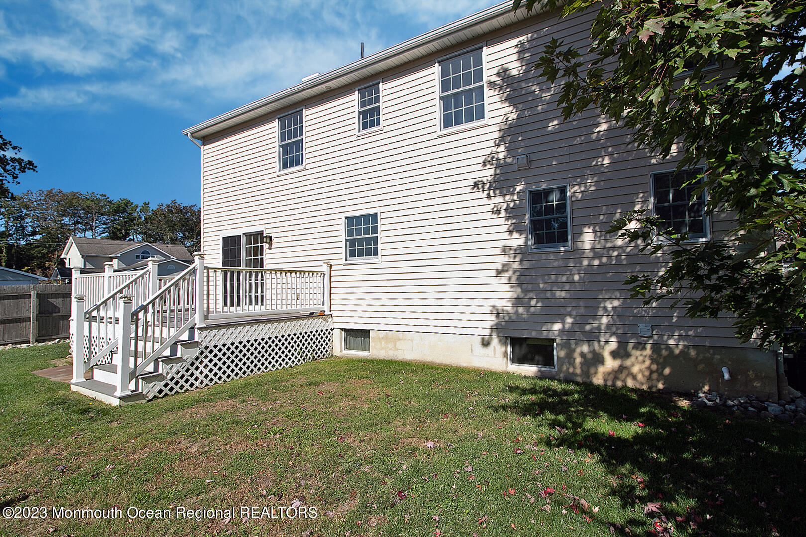 2117 Whitcomb Road Forked River, NJ 08731 - Photo 45 of 49 a view of a house with a small yard and a wooden deck