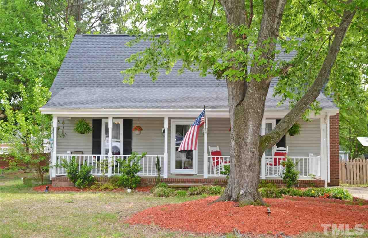 3913 Iron Horse Road Raleigh, NC 27616 - Photo 1 of 20 front view of house with a yard and potted plants