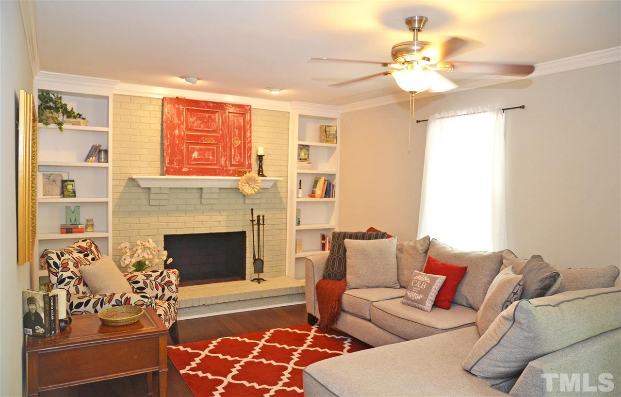 3913 Iron Horse Road Raleigh, NC 27616 - Photo 11 of 20 a living room with furniture and a fireplace