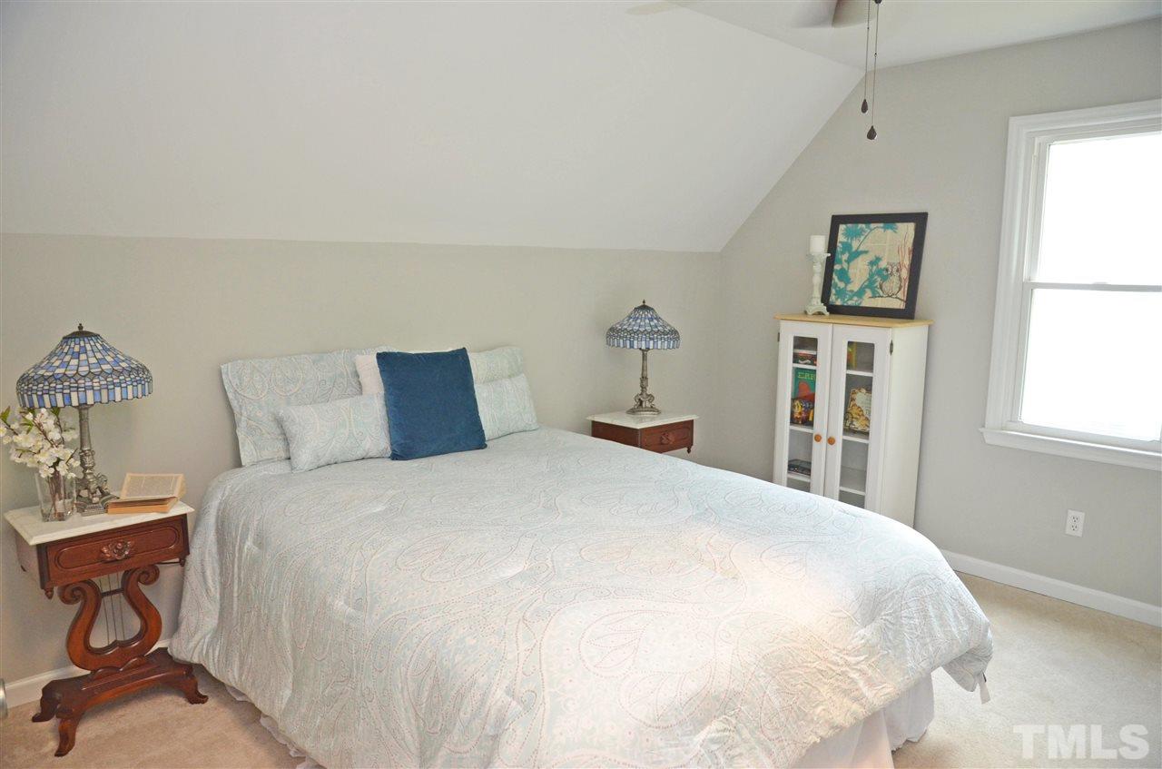 3913 Iron Horse Road Raleigh, NC 27616 - Photo 13 of 20 a large bed sitting in a bedroom next to a window