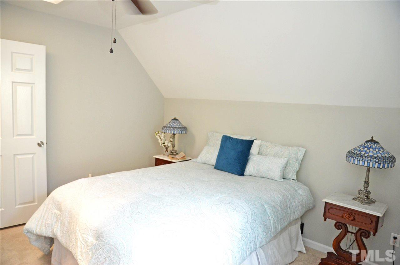 3913 Iron Horse Road Raleigh, NC 27616 - Photo 14 of 20 a bedroom with a bed and a table
