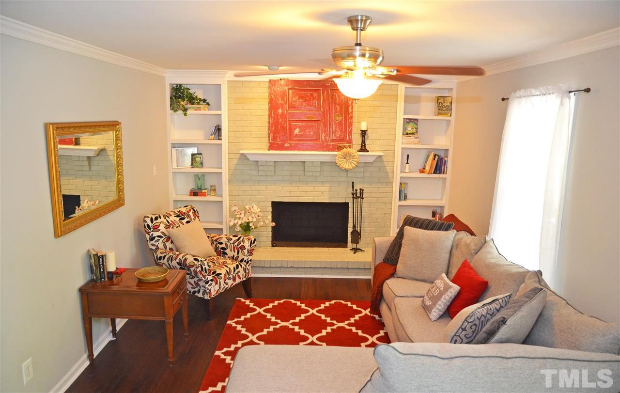3913 Iron Horse Road Raleigh, NC 27616 - Photo 10 of 20 a living room with furniture and a fireplace
