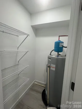 a view of storage and utility room with closet