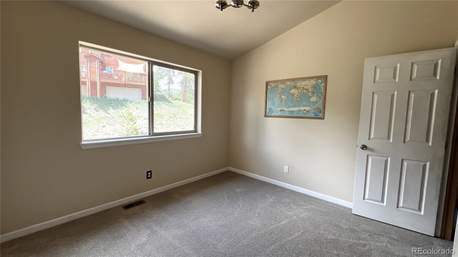 303 Virginia Road, Unit E Bailey, CO 80421 - Photo 8 of 16 a view of an empty room with a window