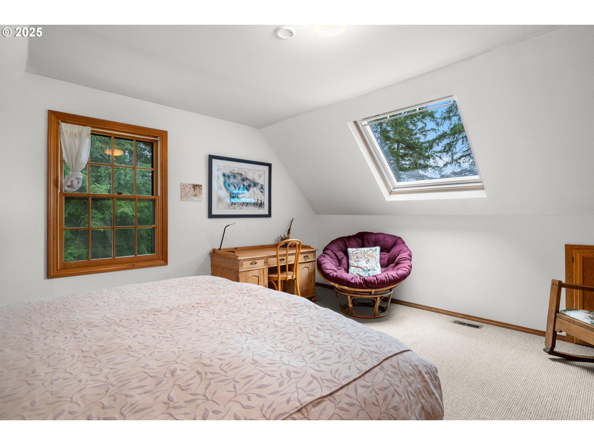 26465 Northwest West Union Road Hillsboro, OR 97124 - Photo 18 of 38 a bedroom with a bed and a chandelier