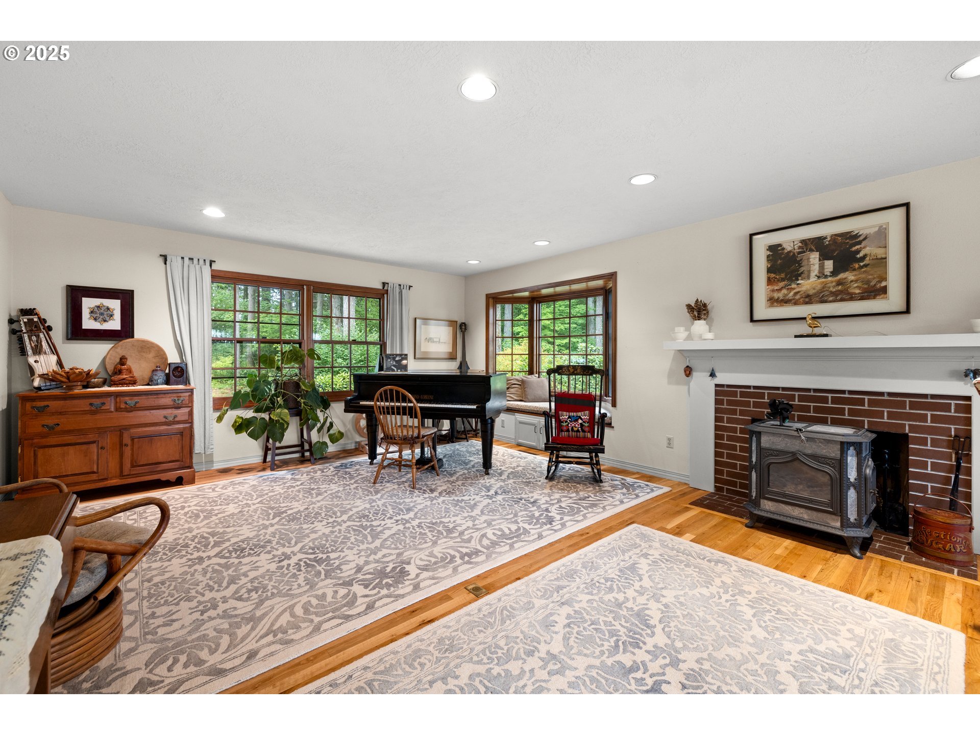 26465 Northwest West Union Road Hillsboro, OR 97124 - Photo 6 of 38 a living room with furniture and a fireplace
