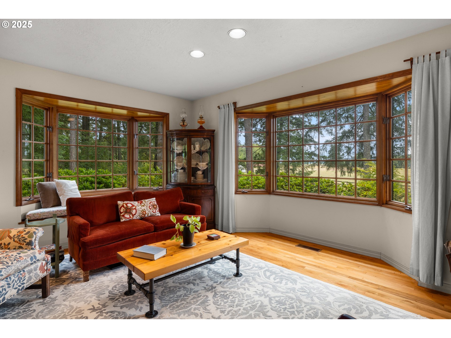 26465 Northwest West Union Road Hillsboro, OR 97124 - Photo 8 of 38 a wooden bench sitting in front of a window