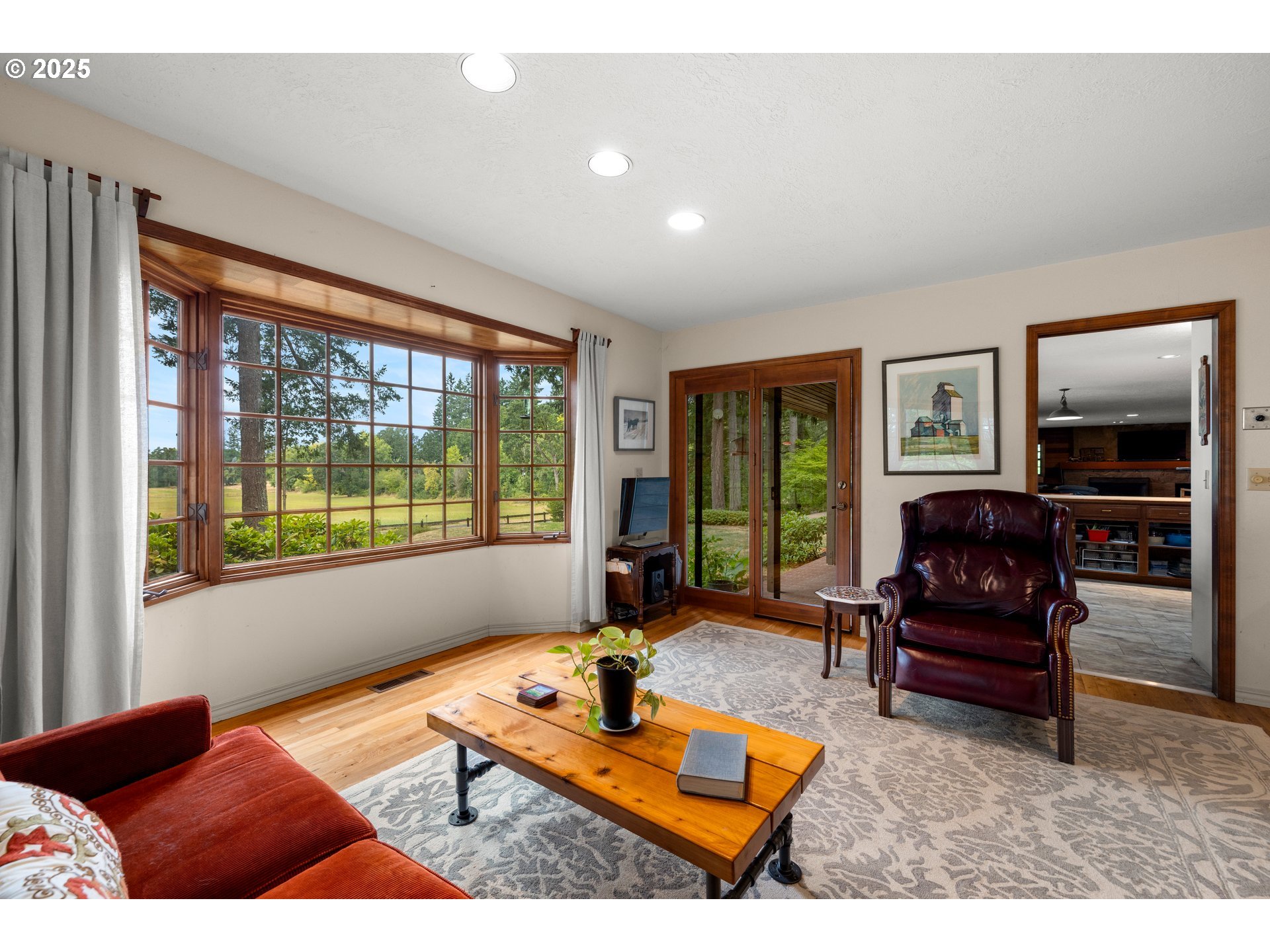 26465 Northwest West Union Road Hillsboro, OR 97124 - Photo 9 of 38 a living room with furniture and a flat screen tv