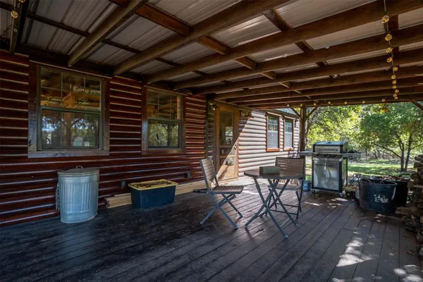a view of a chairs and table in the patio