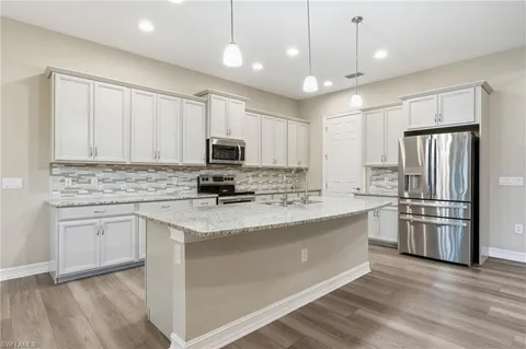 $885,000 | 10240 Avonleigh Drive, Bonita Springs, FL 34135