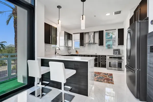 a kitchen with a sink stove and cabinets