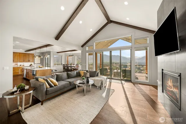 a living room with furniture tv and a fireplace