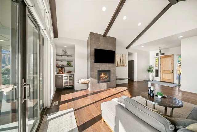 a living room with fireplace furniture and a flat screen tv
