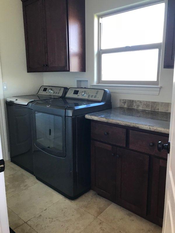 21710 Lone Tree Road Anderson, CA 96007 - Photo 13 of 16 a kitchen with a sink cabinets and a window