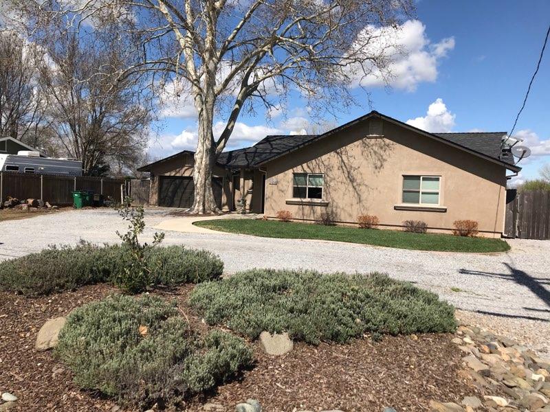 21710 Lone Tree Road Anderson, CA 96007 - Photo 2 of 16 a front view of a house with a yard