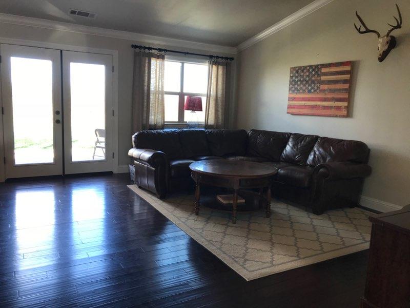 21710 Lone Tree Road Anderson, CA 96007 - Photo 4 of 16 a living room with furniture and a large window