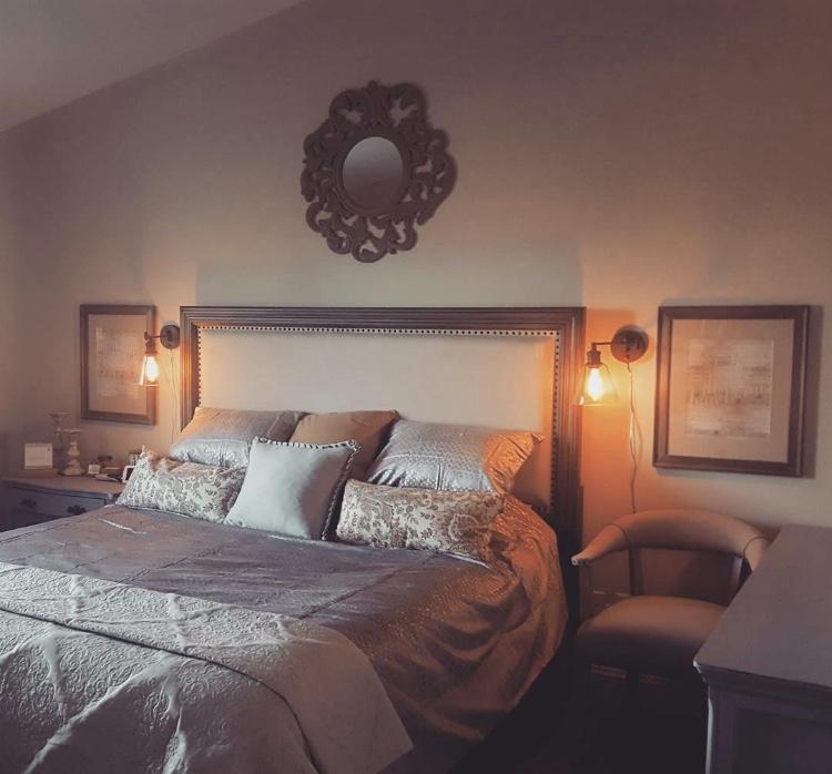 21710 Lone Tree Road Anderson, CA 96007 - Photo 7 of 16 a bedroom with a bed flowerpot and window