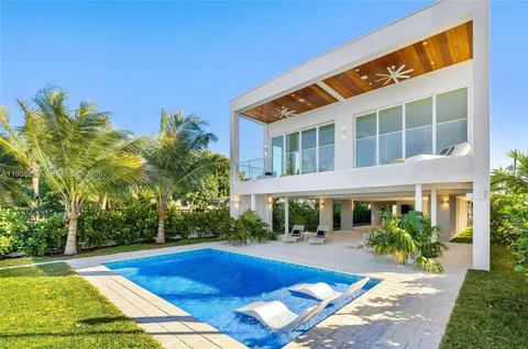 a front view of a house with swimming pool