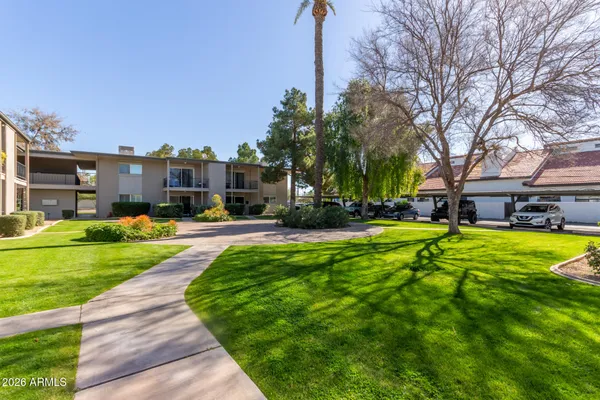 a front view of house with yard and green space