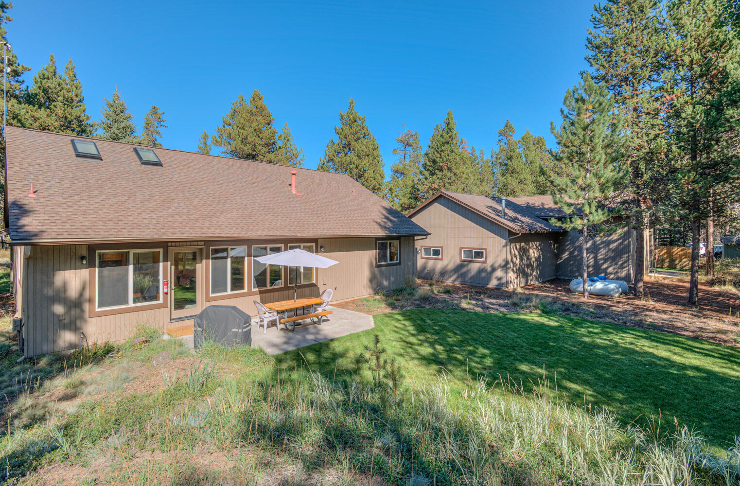 17295 Azusa Road Bend, OR 97707 - Photo 26 of 40 front view of a house with a yard