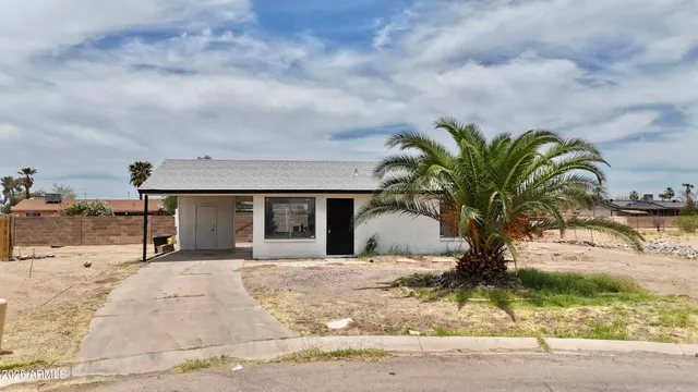 a view of a house with snow on the background