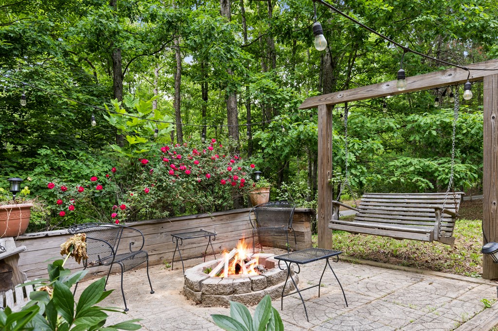 220 Solar Drive Blue Ridge, GA 30513 - Photo 57 of 59 a backyard of a house with lots of green space and outdoor seating