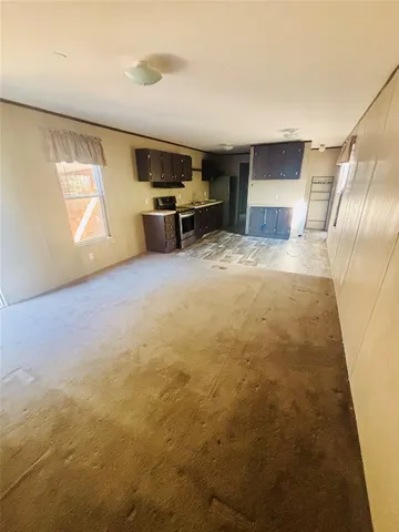 a view of livingroom with furniture and windows