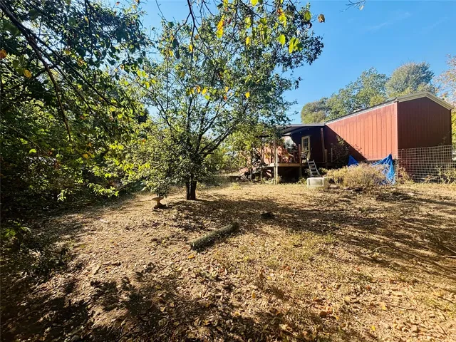 a view of a yard covered in snow