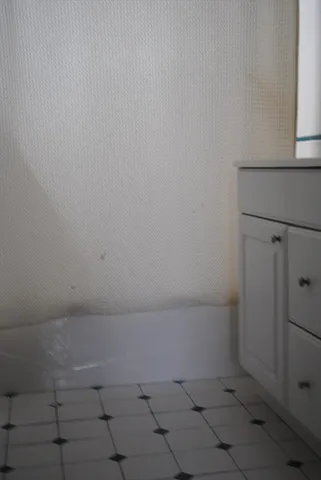 a area with wooden floor and a window