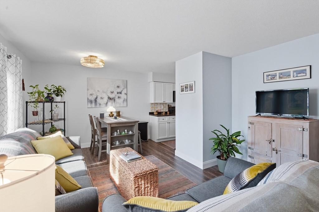 45 Doverbrook Road, Unit 45 Chicopee, MA 01022 - Photo 13 of 33 a living room with furniture and a flat screen tv