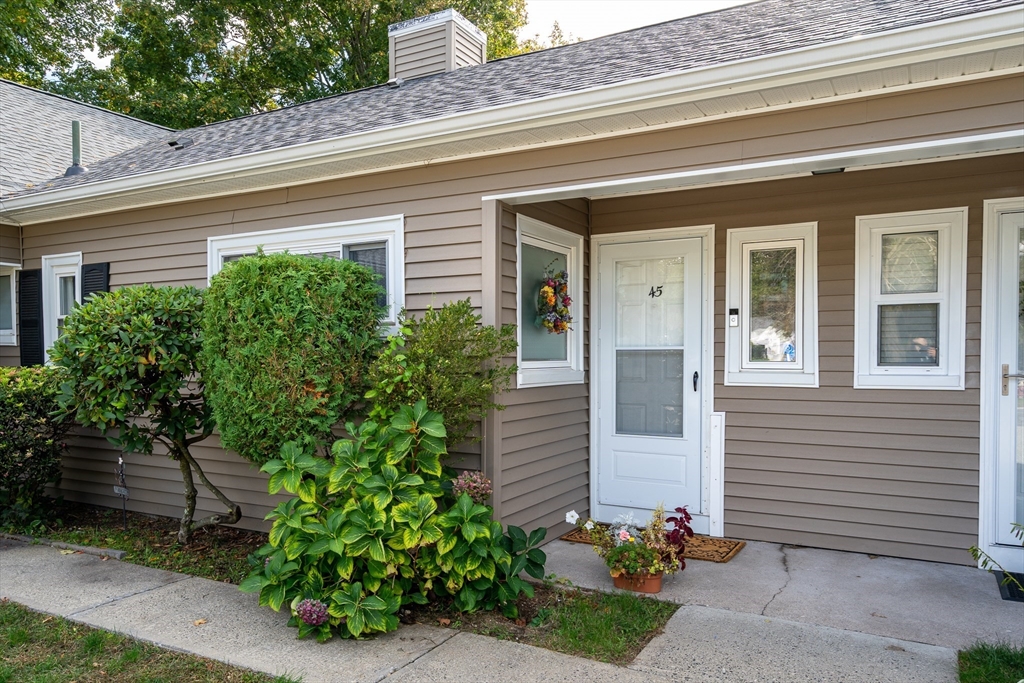 45 Doverbrook Road, Unit 45 Chicopee, MA 01022 - Photo 2 of 33 a front view of a house with garden