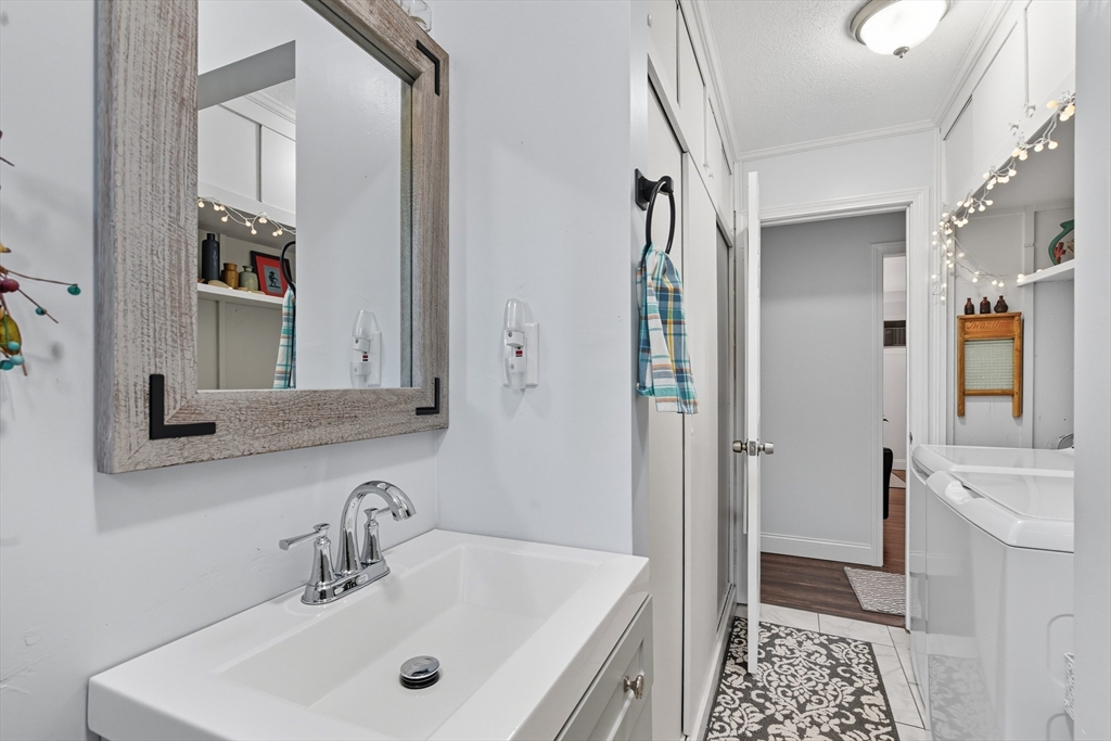 45 Doverbrook Road, Unit 45 Chicopee, MA 01022 - Photo 27 of 33 a bathroom with a sink and a mirror
