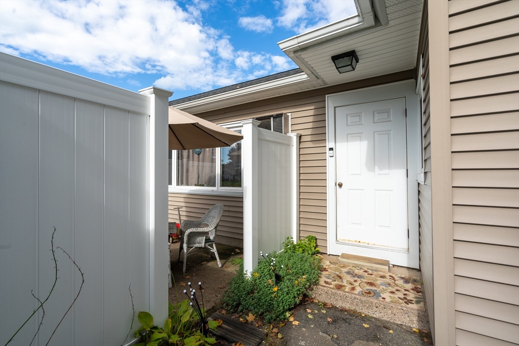 45 Doverbrook Road, Unit 45 Chicopee, MA 01022 - Photo 29 of 33 a front view of a house with potted plants