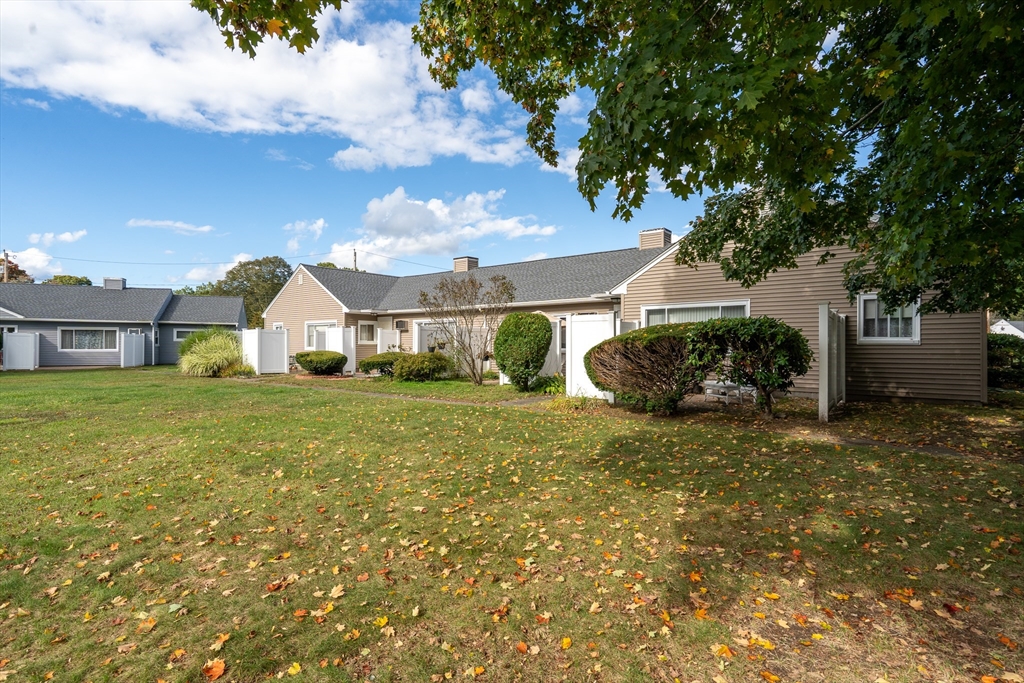 45 Doverbrook Road, Unit 45 Chicopee, MA 01022 - Photo 4 of 33 a front view of a house with a yard and garage
