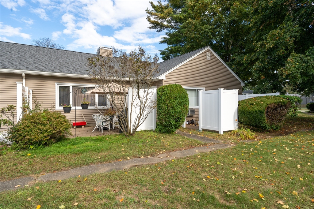 45 Doverbrook Road, Unit 45 Chicopee, MA 01022 - Photo 5 of 33 a front view of a house with a yard and garage