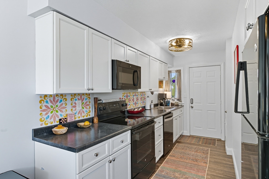45 Doverbrook Road, Unit 45 Chicopee, MA 01022 - Photo 6 of 33 a kitchen with stainless steel appliances granite countertop a sink stove and refrigerator