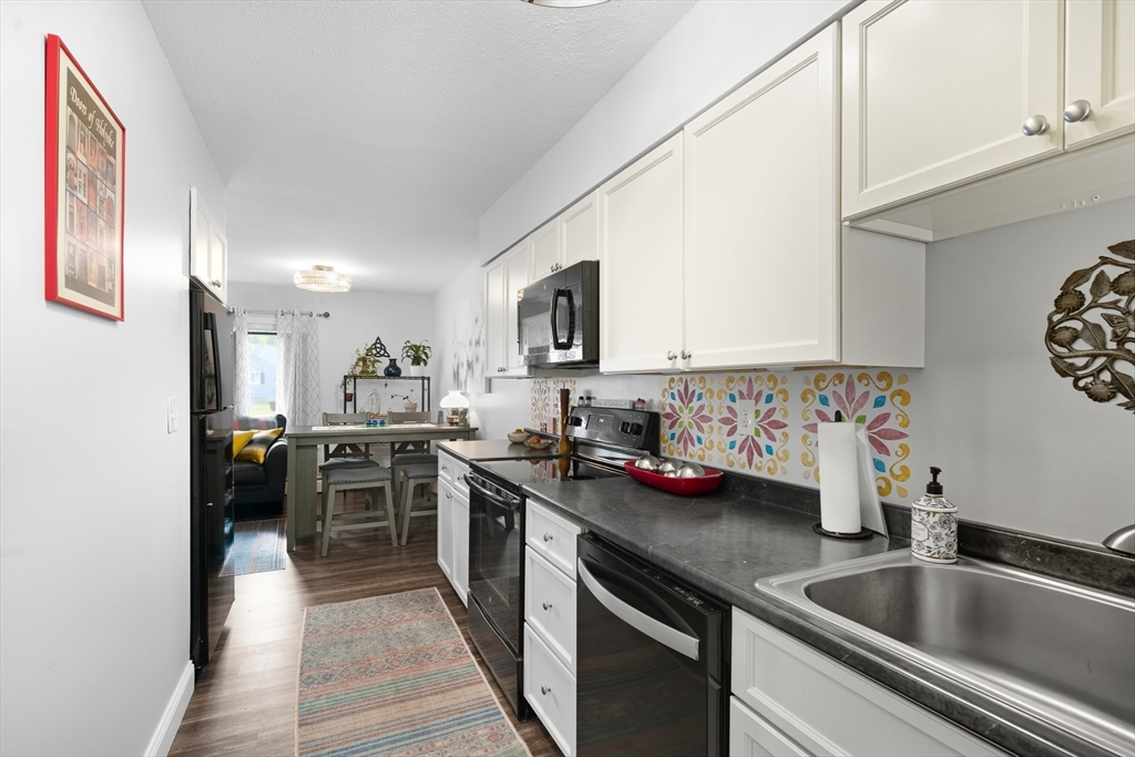 45 Doverbrook Road, Unit 45 Chicopee, MA 01022 - Photo 9 of 33 a kitchen with stainless steel appliances granite countertop a sink stove and refrigerator
