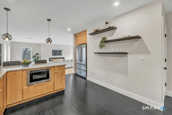 a kitchen with stainless steel appliances a refrigerator sink and stove