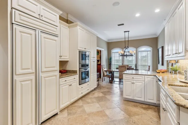 a kitchen with a sink cabinets and window