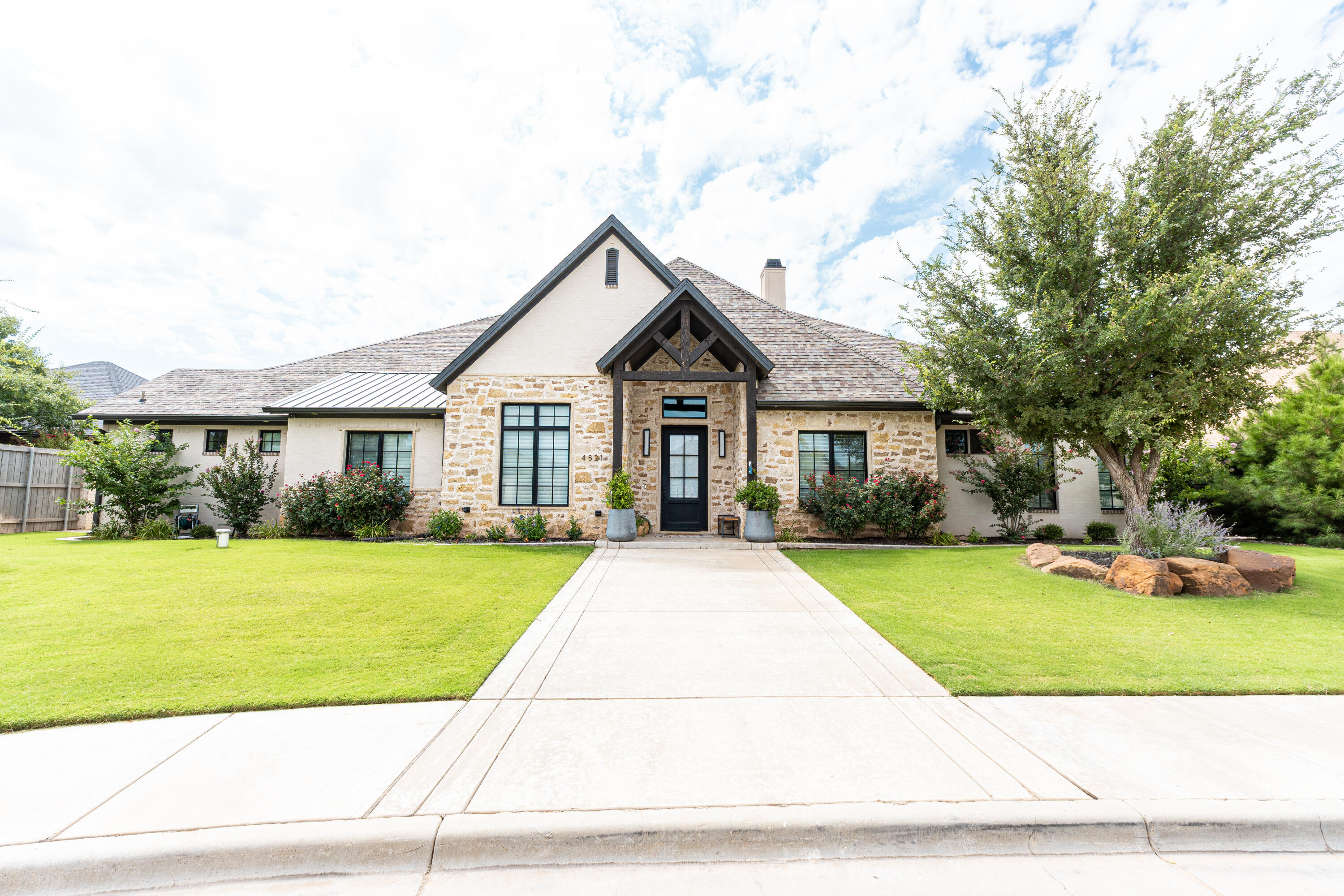 4821 119th Place Lubbock, TX 79424 - Photo 1 of 77 a front view of a house with a yard and garage