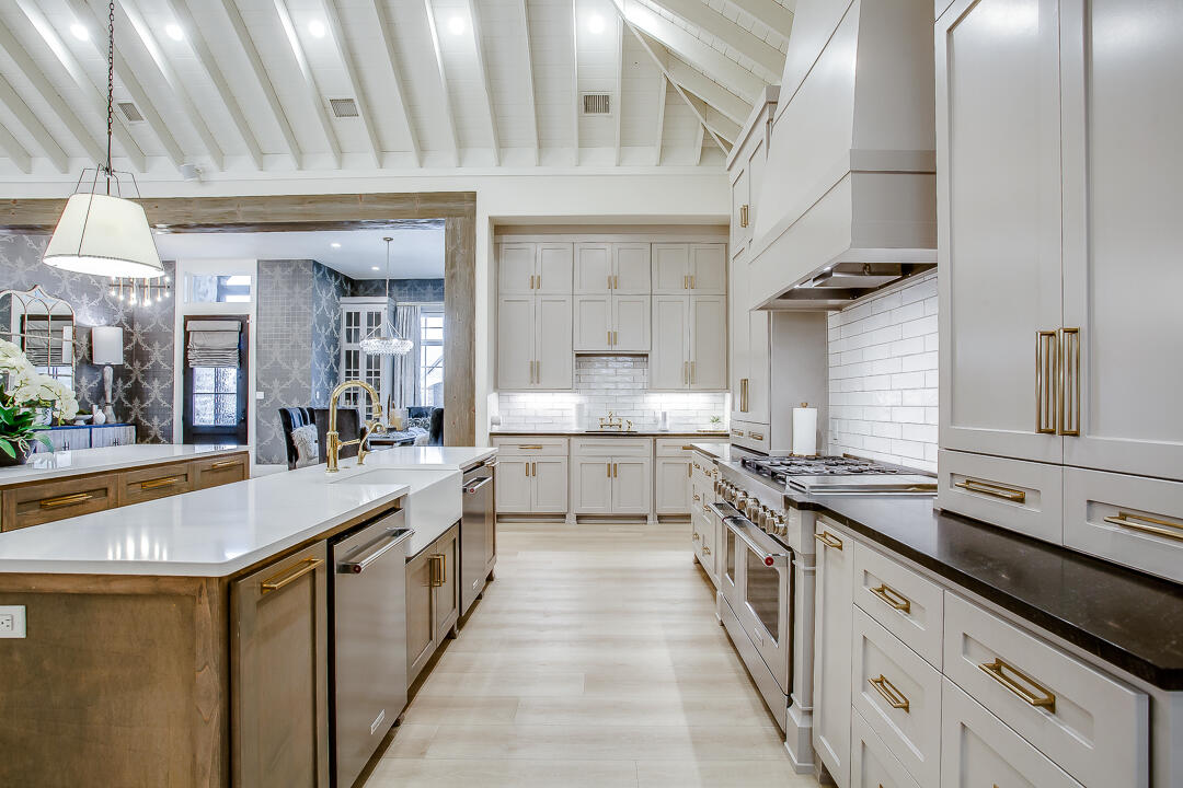4821 119th Place Lubbock, TX 79424 - Photo 14 of 77 a large kitchen with stainless steel appliances granite countertop a lot of counter space and a sink